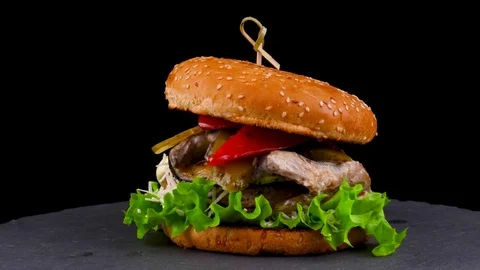 Big Beef burger with grilled vegetables and pickled cucumbers Stock Footage 84652489