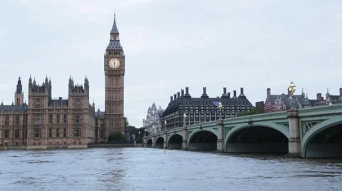 Big Ben and bridge, traffic on bridge at dusk in London Stock Footage 64206480