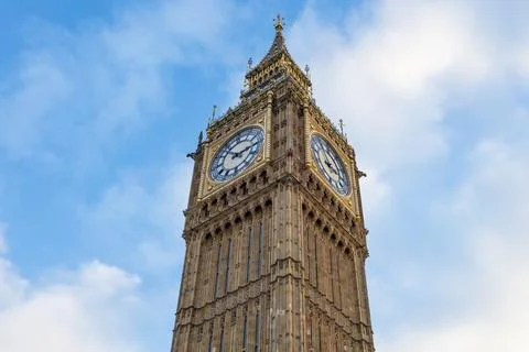 Big Ben Clock Tower Against Blue Sky in London Stock Photos