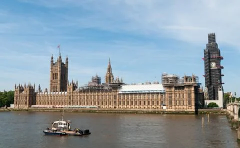 Big Ben clock tower covered by scaffolding for restoration Stock Photos