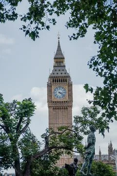 Big Ben Clock Tower Framed by Trees and Statue Stock Photos