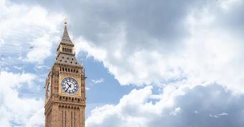 Big Ben iconic clock tower bathed in daylight, emphasizing the golden accen.. Stock Photos