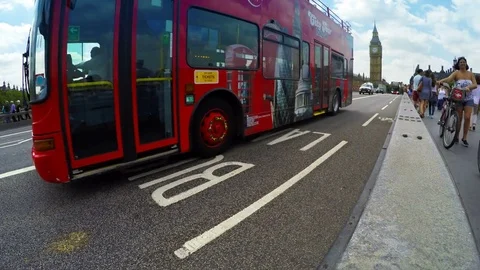 Big Ben Tower and red double-decker busses passing on Westminster Bridge, London Stock Footage 79932049