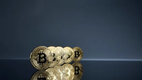 Big bitcoins lined up, slow motion, macro Stock Footage 126558623