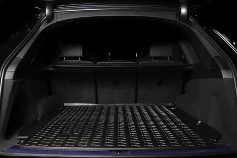 The big black empty trunk of SUV car with rubber mat and with leather folder  Foto stock