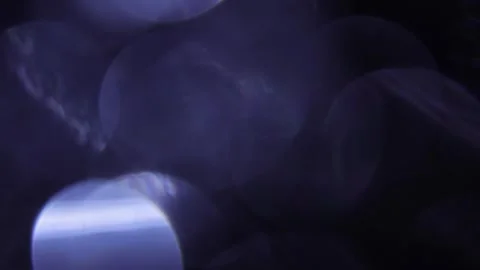 Big blue bokeh lights in the dark 스톡 동영상 318917668