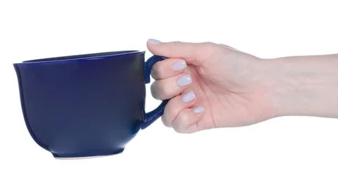 Big blue cup mug in hand Stock Photos