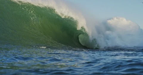 Big Blue Ocean Wave Breaking in Slow Motion 4K in dangerous shallow water Stock Footage 81598463