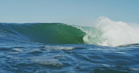 Big Blue Ocean Wave Breaking in Slow Motion 4K in dangerous shallow water Stock Footage 81599544