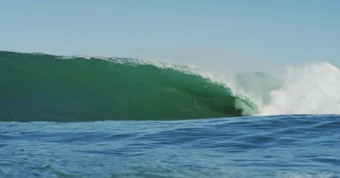 Big Blue Ocean Wave Breaking in Slow Motion 4K in dangerous shallow water Stock Footage 81600850
