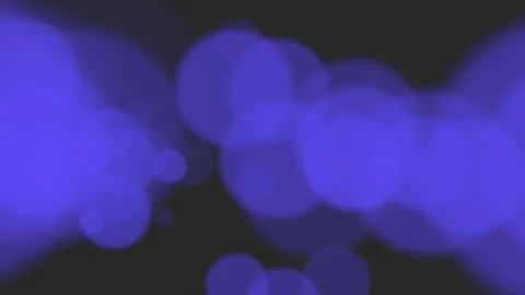 Big blue particles and round bokeh on bl... | Stock Video | Pond5