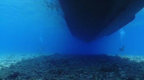 Big boat floating over coral reef - underwater shot. Stock Footage 31450191
