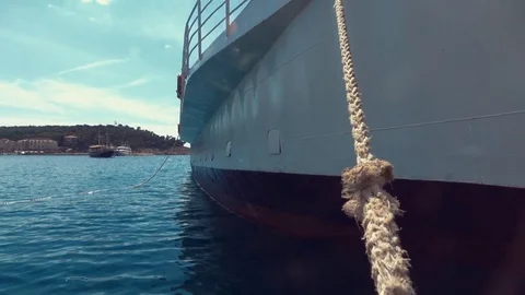 Big boat in ocean attached to rope Stock Footage 79623974