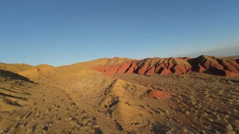 Big bogdo mountain changing colors during the day Stock Footage 302623997
