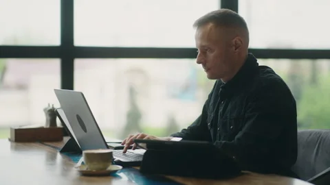 Big Boss Of Modern IT-Company Working Remotely From Cafe, Using Many Gadgets Stock Footage 242907053