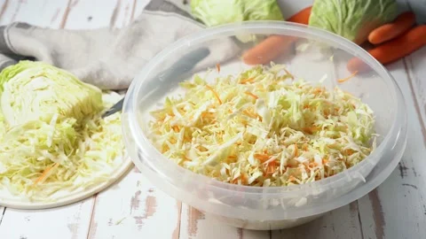 A big bowl with chopped cabbage ready for fermentation Stock Footage 144846641