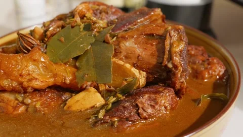A big bowl of spiced braised beef soaking in rich broth. Stock Footage 343327779