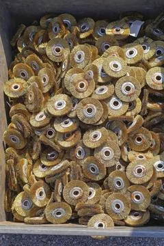 Big box of brass wire wheels disc tools Stock Photos