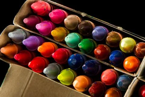 Big box of many crayons Stock Photos