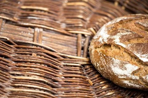 Big bread in a basket Stock Photos