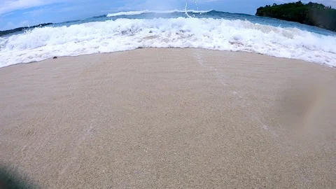 Big breaking Ocean wave on a sandy beach Stock Footage 102987126