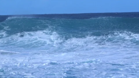 Big breaking, rolling waves filmed from the beach. Huge dangerous swell Stock Footage