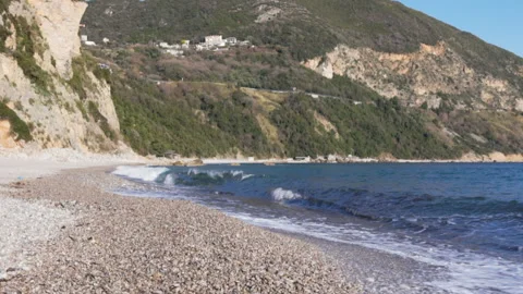 Big breaking sea wave on a beach in sunny day slow motion Stock Footage 104989616