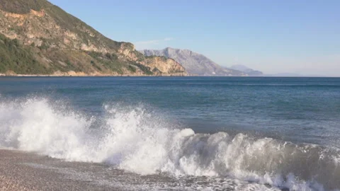 Big breaking sea wave on a beach in sunny day slow motion Stock Footage 104991353