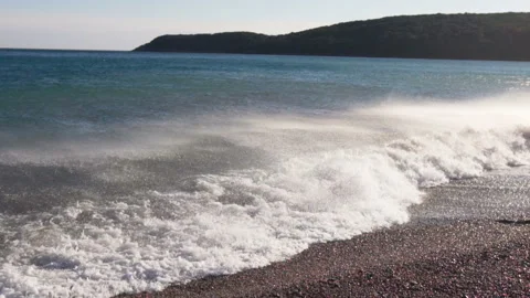 Big breaking sea wave on a beach in sunny day slow motion Stock Footage 104991801