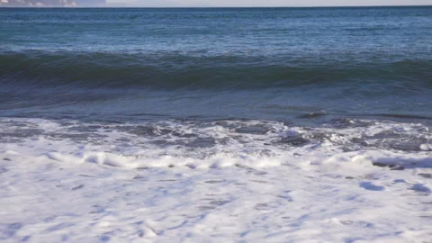 Big breaking sea wave on a beach in sunny day slow motion Stock Footage 104992727