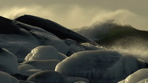 Big Breaking wave behind the rock, lots of sea spray Video stock 94682880