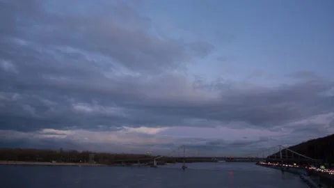 Big bridge across the river at sunset in Kiev, fast clouds Video stock 170603108