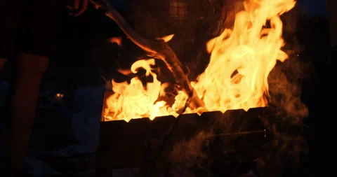 Big bright flame, fire, a bonfire with lights, sparks, ash, smoke in slow motion Stock Footage 132179515