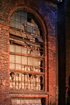 Big, broken and walled window in an old factory building Fotos de archivo
