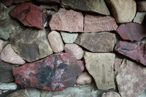 Big brown stone in the wall background Stock Photos