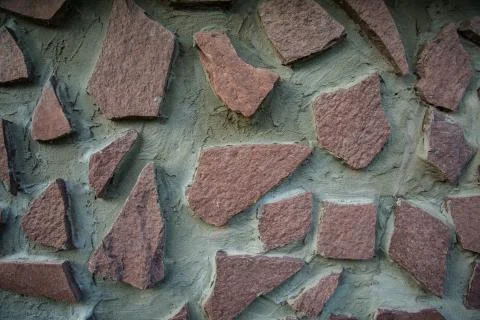 Big brown stone in the wall background Foto stock