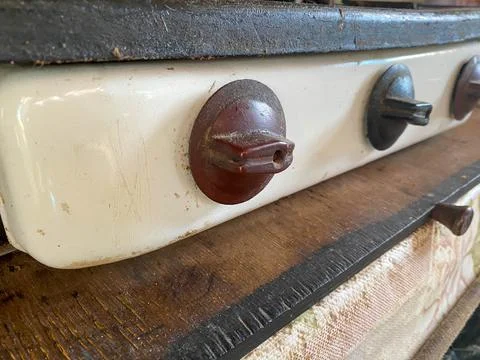 Big brown toggle switches knobs regulators dirty old retro to control applian Fotos de archivo