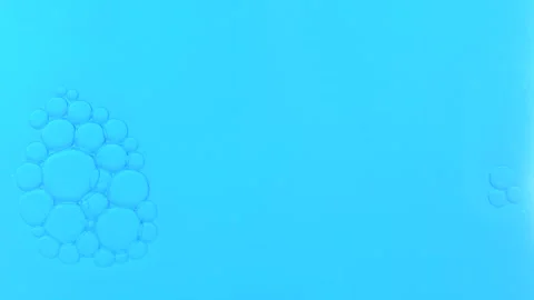 Big bubbles rising to the blue background. Macro shot of water with air bub.. Stock Footage 275076091