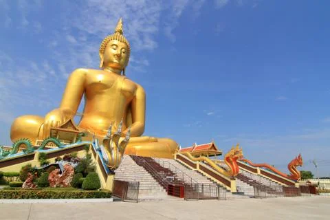 Big buddha image on blue sky background . Stock Photos