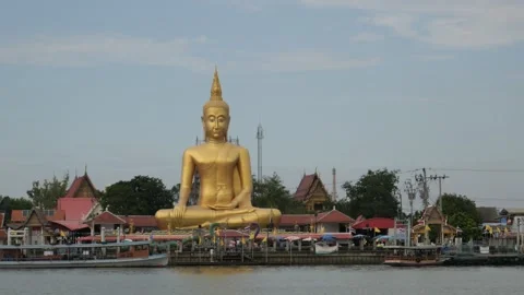 Big Buddha, river and pier in Thailand Stock Footage 257539555