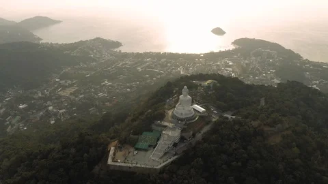 Big Buddha statue on the hill in Phuket Island Sunset 4K Drone flight Stock Footage 119732474
