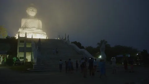 Big Buddha statue illuminated from all sides in the fog at night in Phuket Stock Footage 223819853