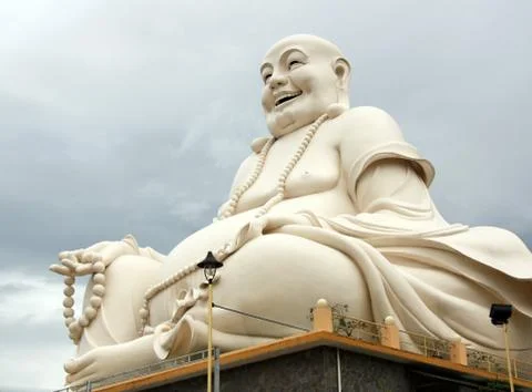 Big Buddha statue over cloudy sky Stock Photos