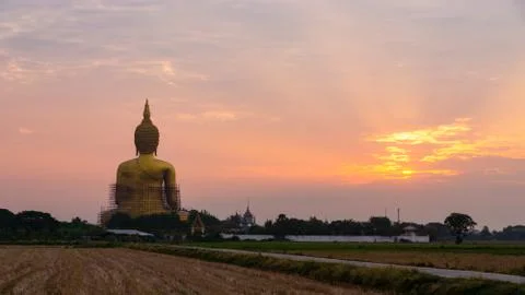 Big buddha statue at sunset time. Stock Photos