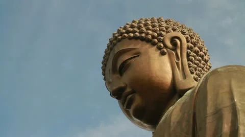 Big Buddha tilt up close up with clouds background Stock Footage 12296580
