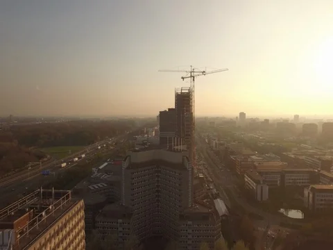 Big building being constructed during sunset Stock Footage 75924437