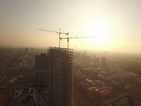 Big building being constructed during sunset Stock Footage 75924526