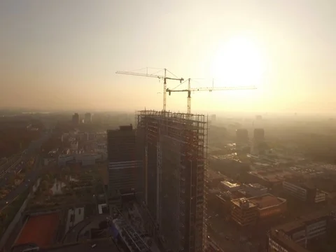Big building being constructed during sunset Stock Footage 80909569