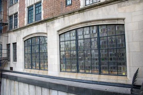 A big building has some windows and no doors on the outside Fotos de archivo