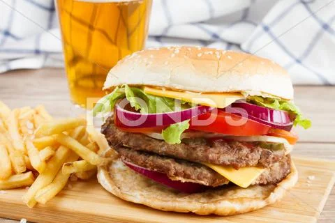 Big burger with french fries and beer Stock Photos